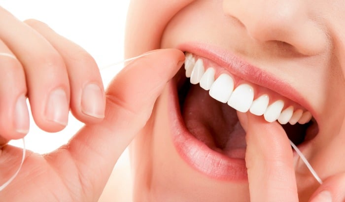 woman flossing