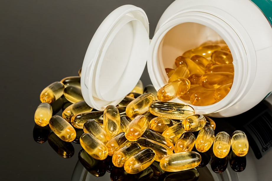 transparent capsules in a plastic container